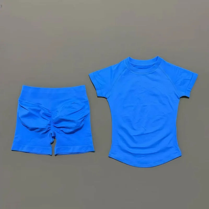 A bright blue seamless yoga set for women featuring a short sleeve top and workout shorts.