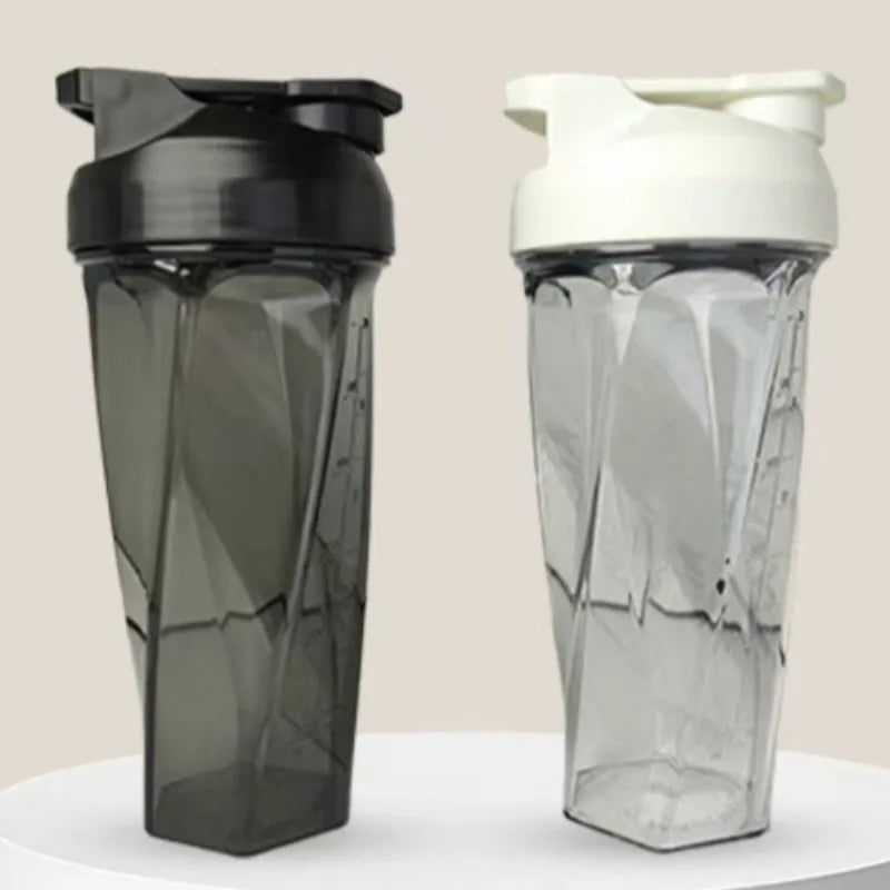 A clear and black high-performance Tritan protein shaker bottle shown from the side.