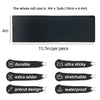 Roll of black kinesiology turf tape measuring 4 inches wide and 7 yards long