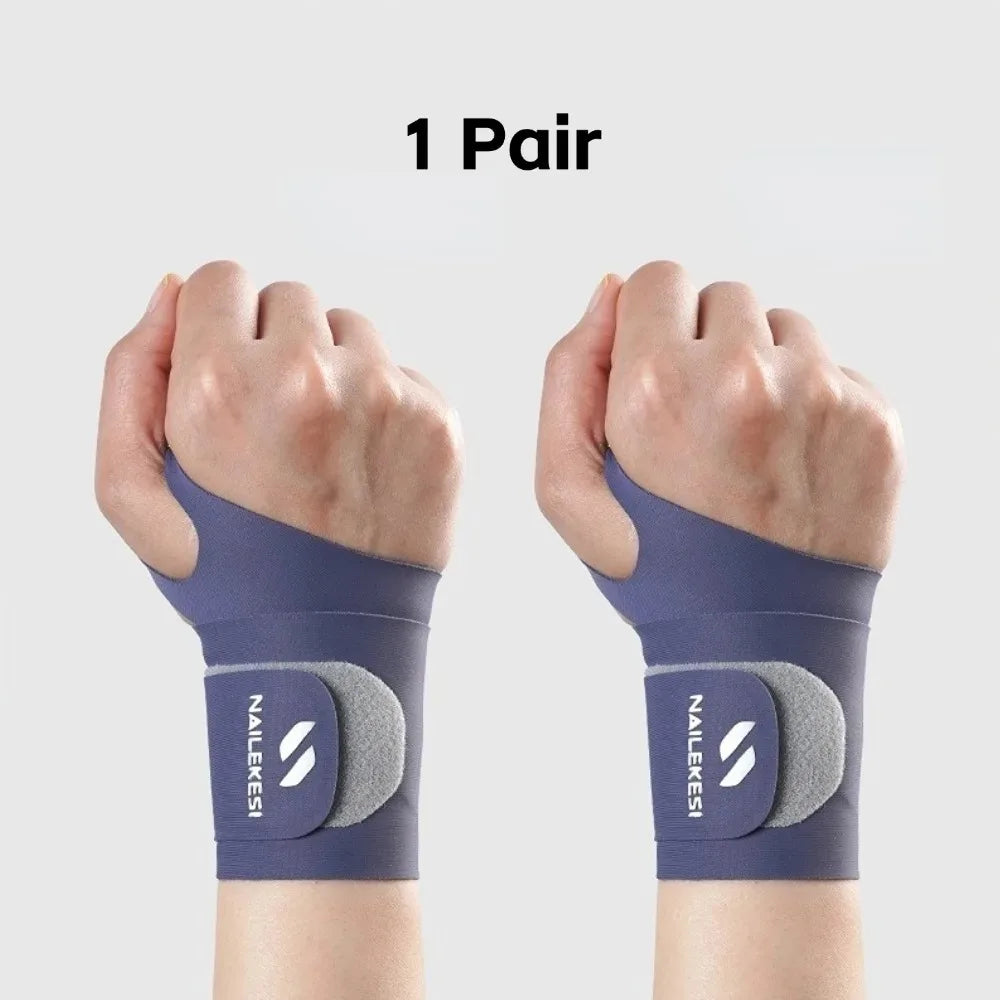 A pair of dark blue wrist compression braces shown on a person's hands.