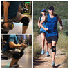 A woman wearing a blue athletic top and black knee brace runs on a dirt path.