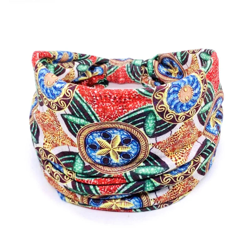 A colorful bohemian stretch cotton headband featuring intricate patterns and gold accents.