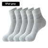 A stack of five grey bamboo fiber socks shown from the side.