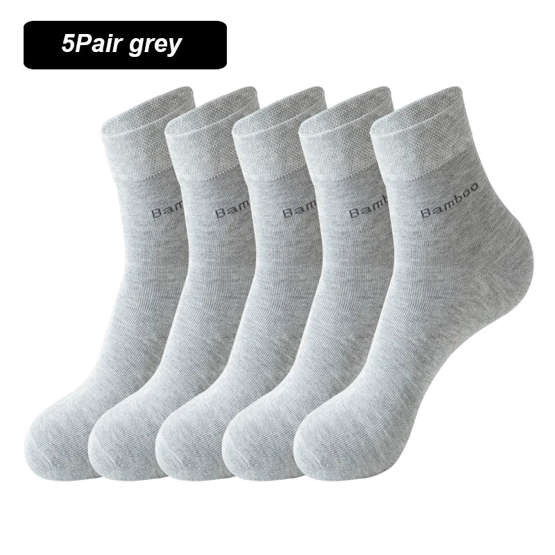 A stack of five grey bamboo fiber socks shown from the side.