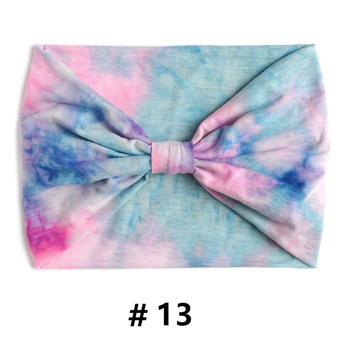 Bandeau en coton tie-dye rose et bleu noué en nœud.