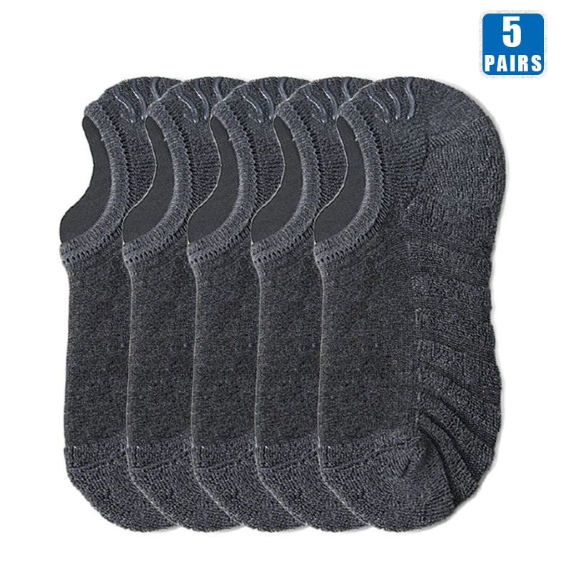 Five pairs of dark gray men's cotton crew socks stacked together.