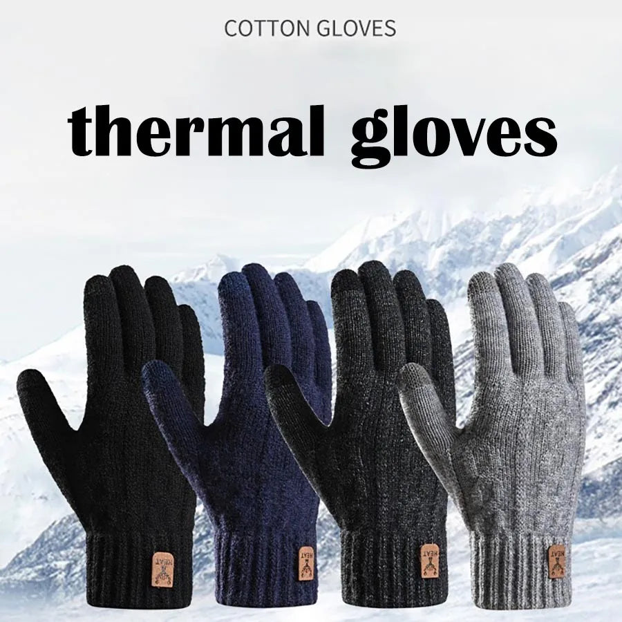 A close-up of several black and navy thermal knit gloves displayed against a snowy mountain background.