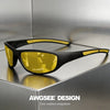 A pair of black polarized sports sunglasses with yellow lenses resting on a metallic surface.