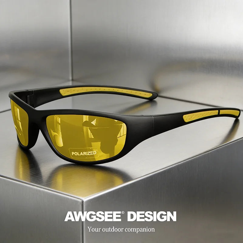 A pair of black polarized sports sunglasses with yellow lenses resting on a metallic surface.