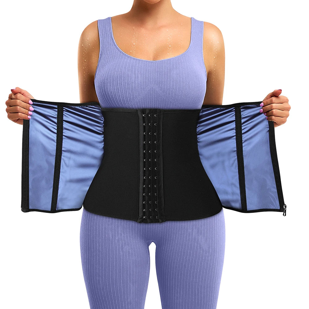 A woman wearing a purple body shaping waist trainer corset with black panels on a light purple top.