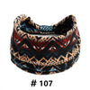 A close-up of a black and brown patterned boho cotton turban headband.