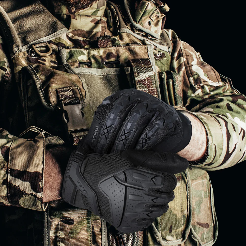 A close-up of a person wearing black tactical touch screen gloves while in camouflage military attire.