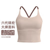 A beige sports bra with thin straps shown against a white background.