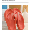 A pair of bright orange comfort platform flip flops shown in a product real shot.