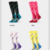 A collection of compression leg and calf socks in black, red, white, and yellow colors displayed vertically.