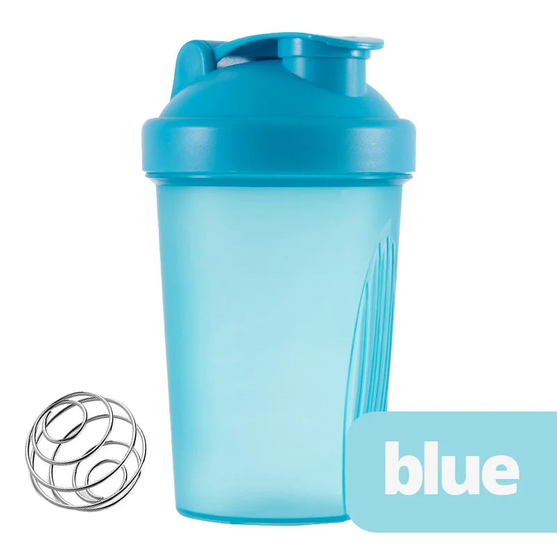 A light blue leak-proof shaker bottle with a flip cap and a wire whisk accessory.