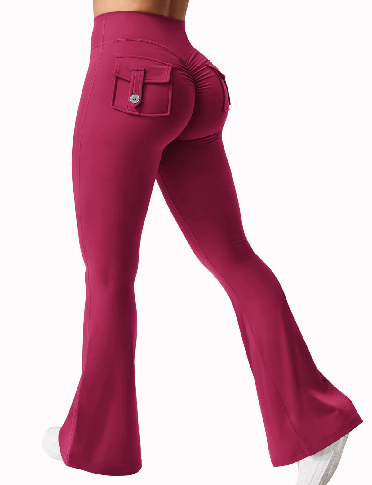 A model wearing magenta high stretch yoga leggings with a front pocket and a small detail on the thigh.