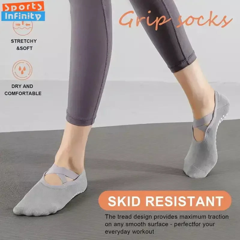 Gray silicone grip socks shown on a foot, designed for skid resistant traction during workouts.