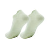 A pair of light green women's yoga and fitness socks shown from the side.