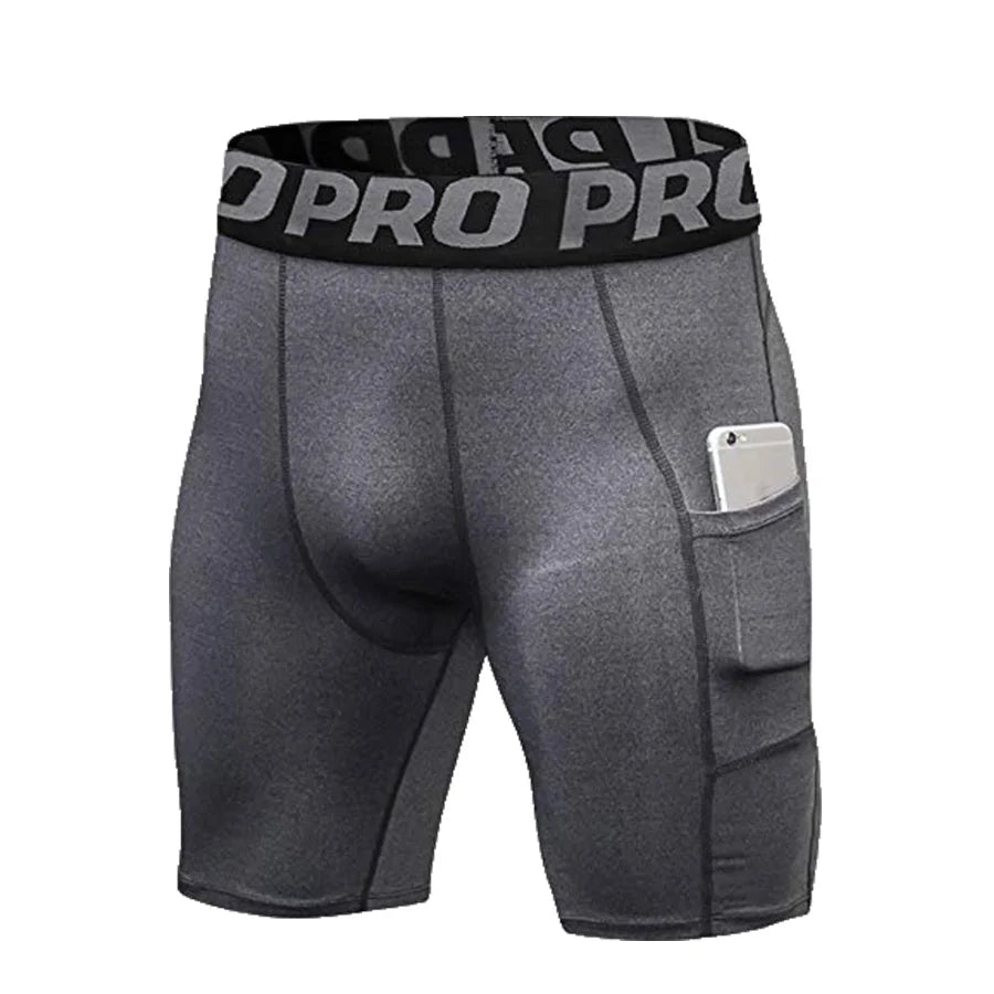 Shorts deportivos de compresión grises para hombre con cintura negra y bolsillo lateral.