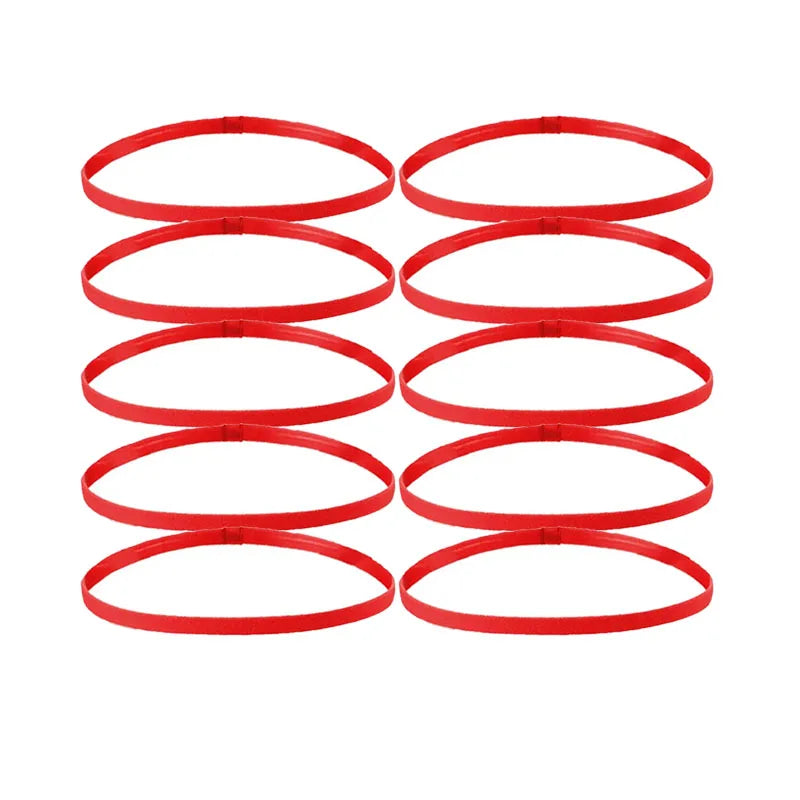 A set of five red multi-functional elastic sports headbands laid out in a row.