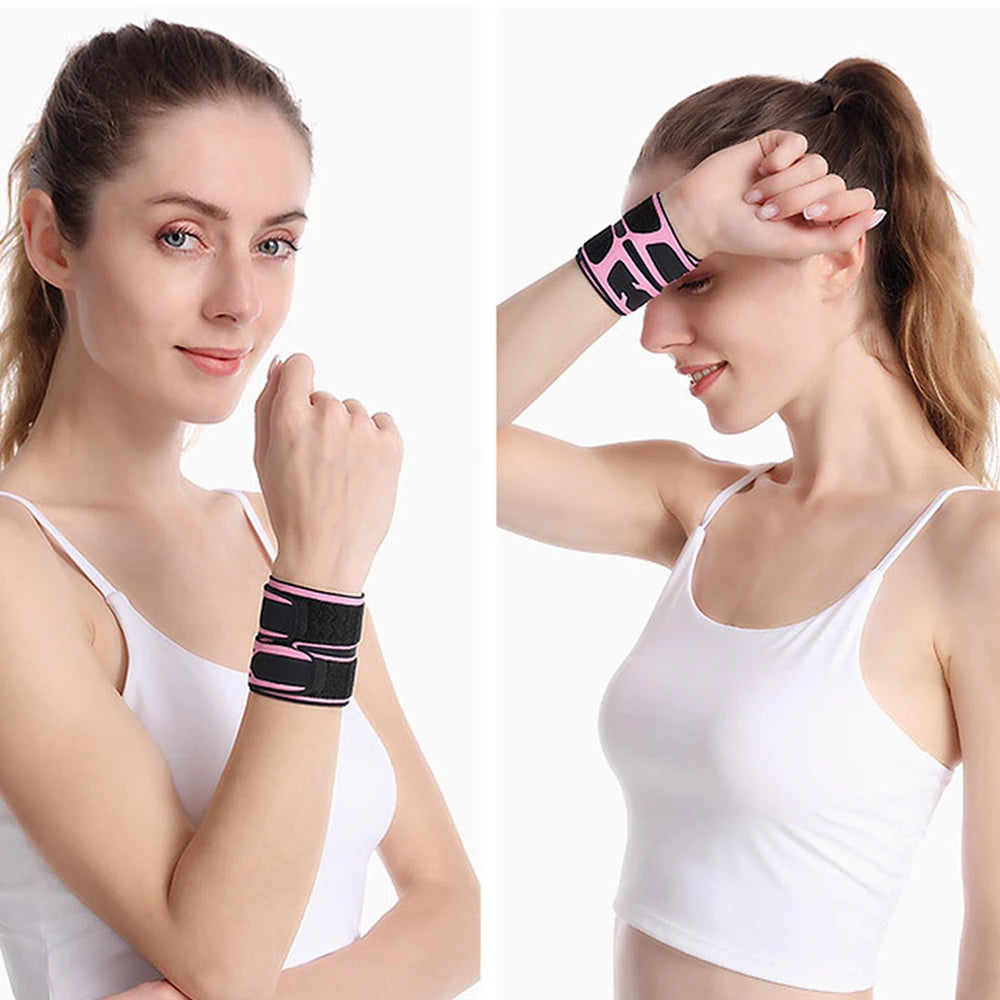 A woman wearing a black and pink adjustable wrist support brace on her wrist.