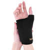 A hand is wearing a black knee sleeve for hot and cold therapy.