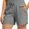 A model is wearing gray high-waisted quick-dry athletic shorts with a drawstring waist.