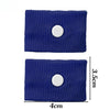 A pair of dark blue anti-nausea wristbands with a white stud, shown against a white background.
