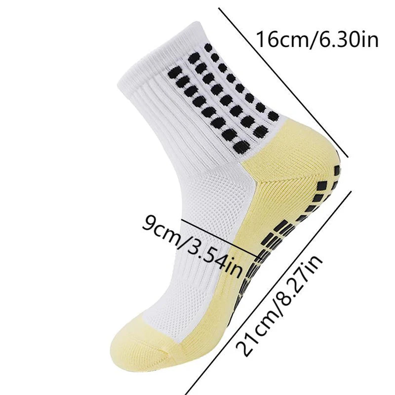 A pair of white and yellow men's grip soccer socks with knee pads shown from the side.