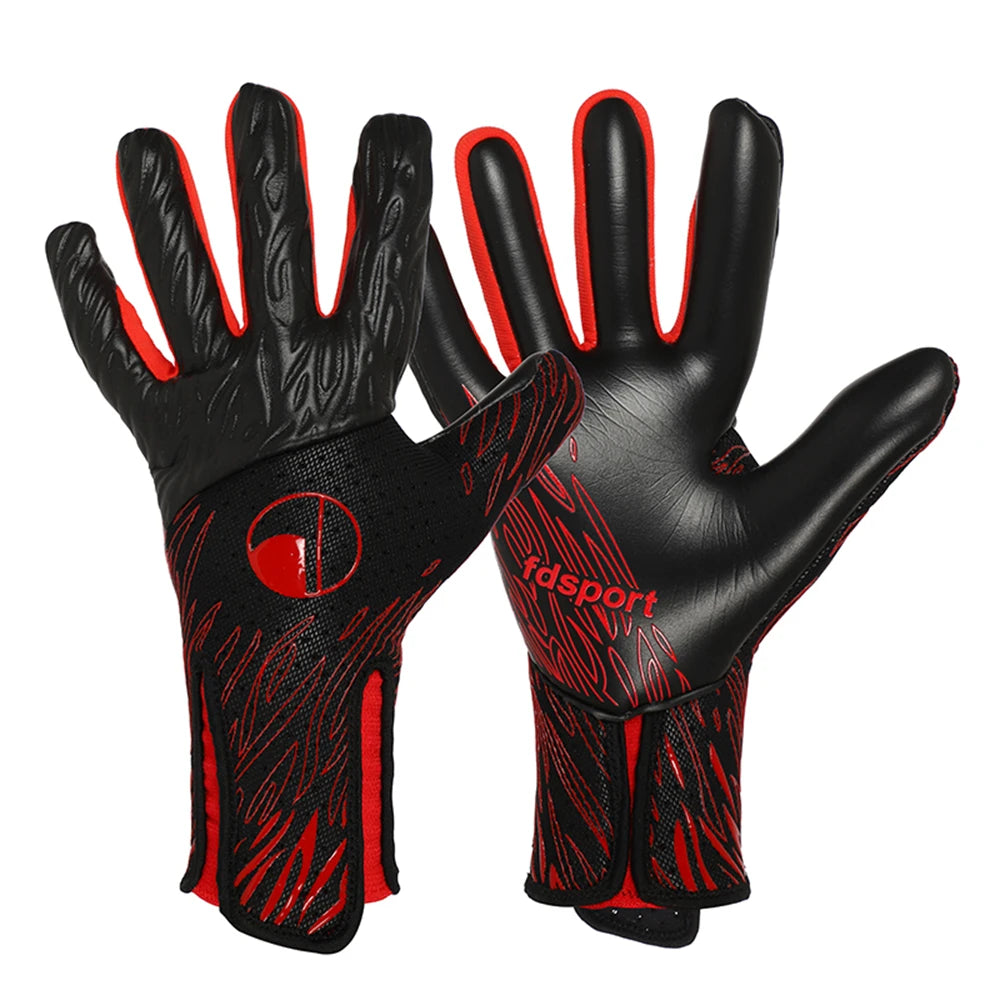 Un par de guantes de portero negros y naranjas para fútbol o soccer
