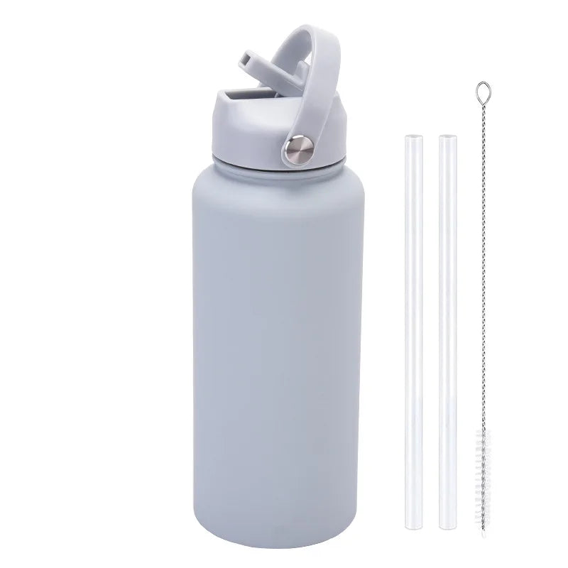 A light gray stainless steel vacuum flask water bottle with a hinged lid and an attached metal straw.