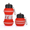 A red and white foldable silicone sports water bottle with a black cap and clip.