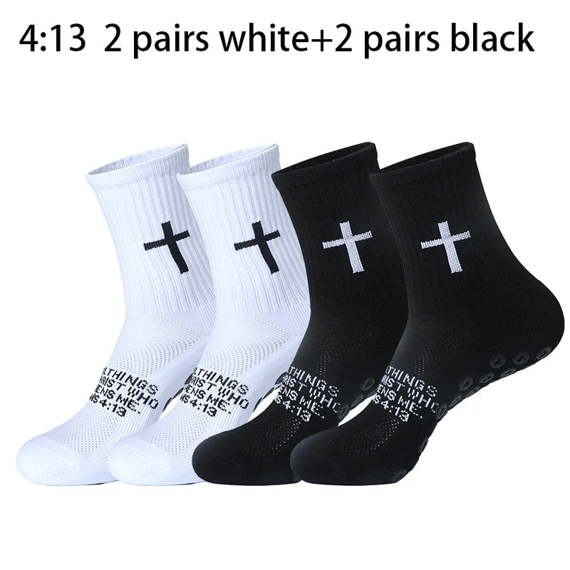 A collection of white and black sports socks featuring a cross design for prayer and Christian use.