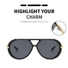 Black vintage oversized designer sunglasses shown with a close-up detail of the frame.