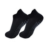 A pair of black women's yoga and fitness socks shown from above.