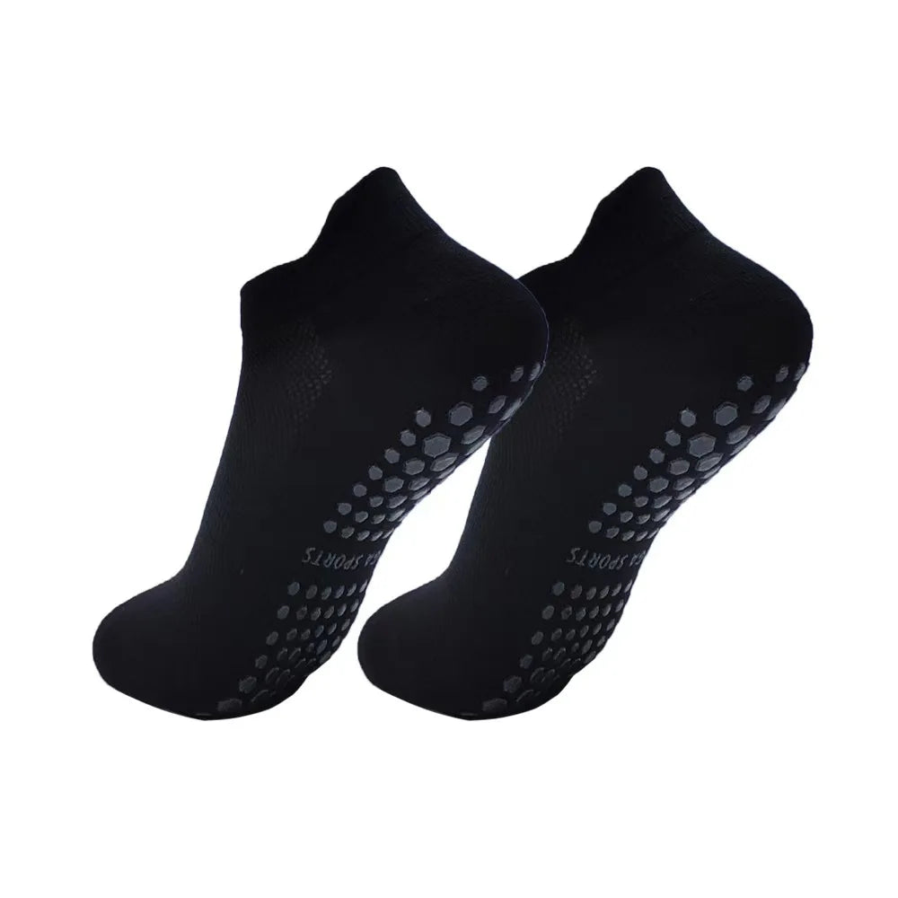 A pair of black women's yoga and fitness socks shown from above.