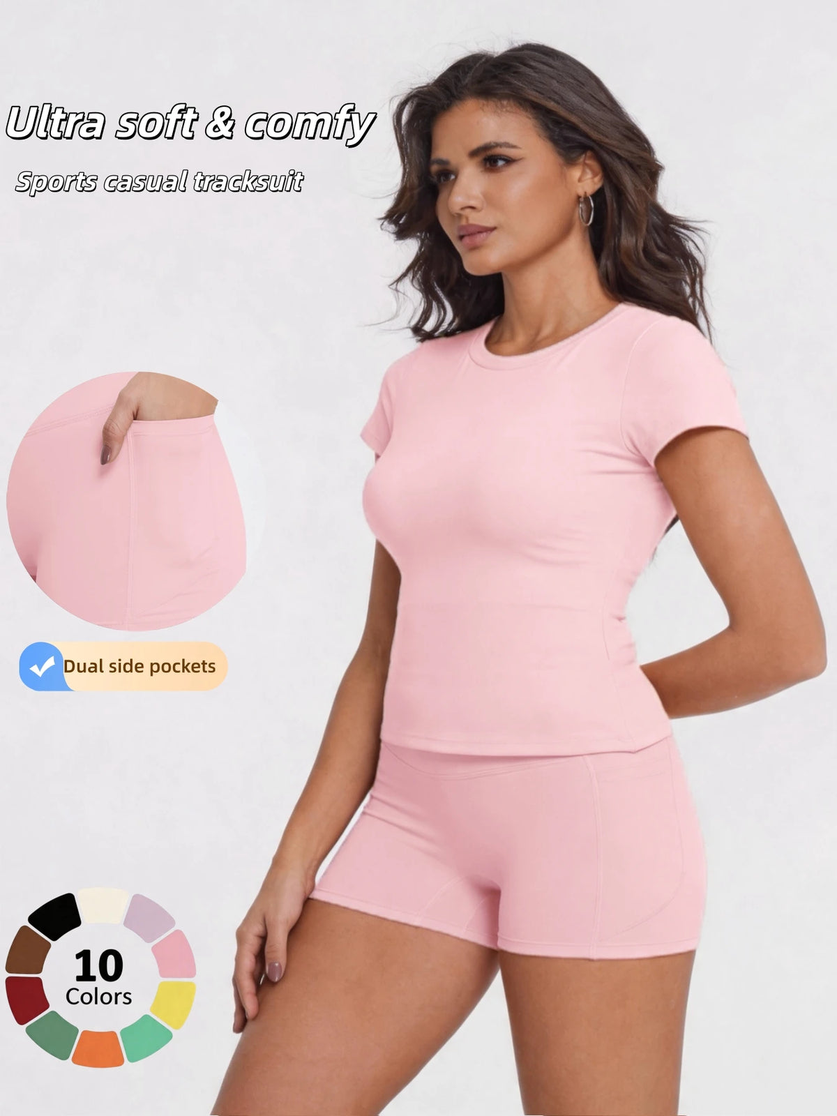A woman models a pink sports casual tracksuit top and shorts, highlighting dual side pockets.