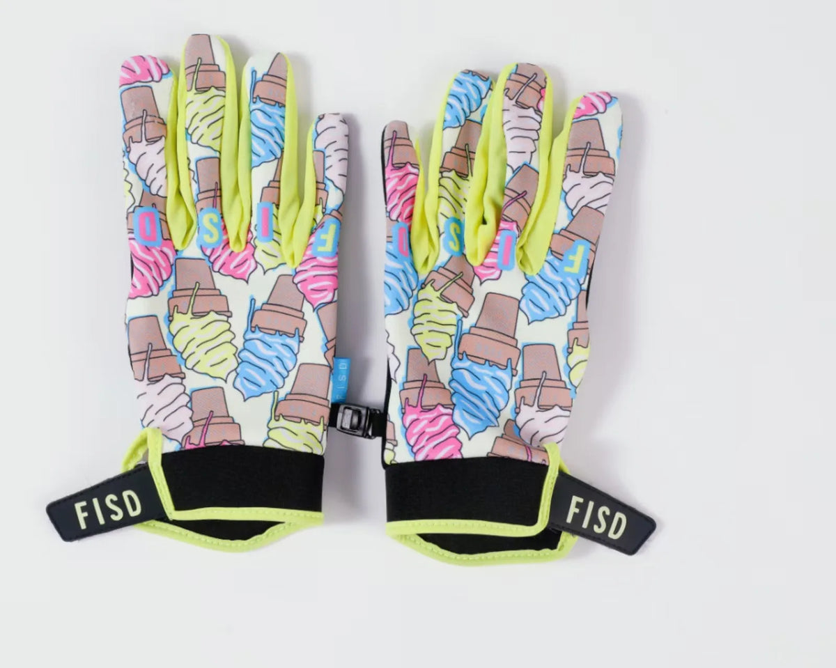 Une paire de gants de motocross roses et jaunes avec un motif.