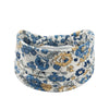 A floral butterfly headband featuring blue and yellow flowers on a white background.