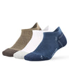 A stack of five breathable performance running socks in various earth tones including beige, olive green, white, and navy blu