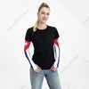 A woman models black t-shirt with UV protection arm sleeves featuring red and white accents.