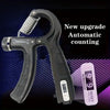 A black hand grip strengthener with a silver spring, showing the automatic counting feature and a separate reset button.
