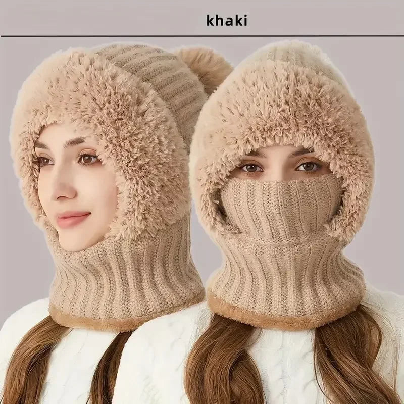 Eine Frau modelliert eine beige Fleece-Mütze mit winddichten Ohrenabdeckungen.