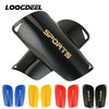 A set of black soccer shin guards for various ages and sizes shown from multiple angles.