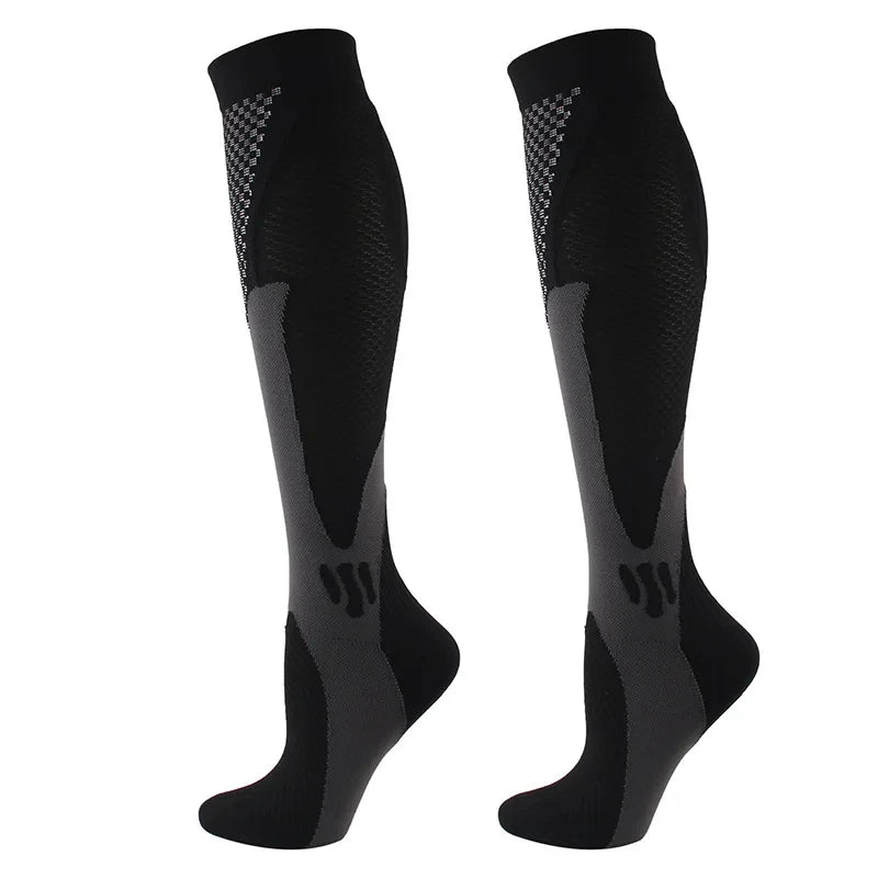 A pair of black compression socks designed for circulation and recovery.