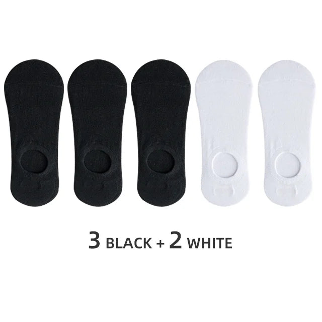 A set of five men's invisible silicone no-show socks, consisting of three black and two white pairs.