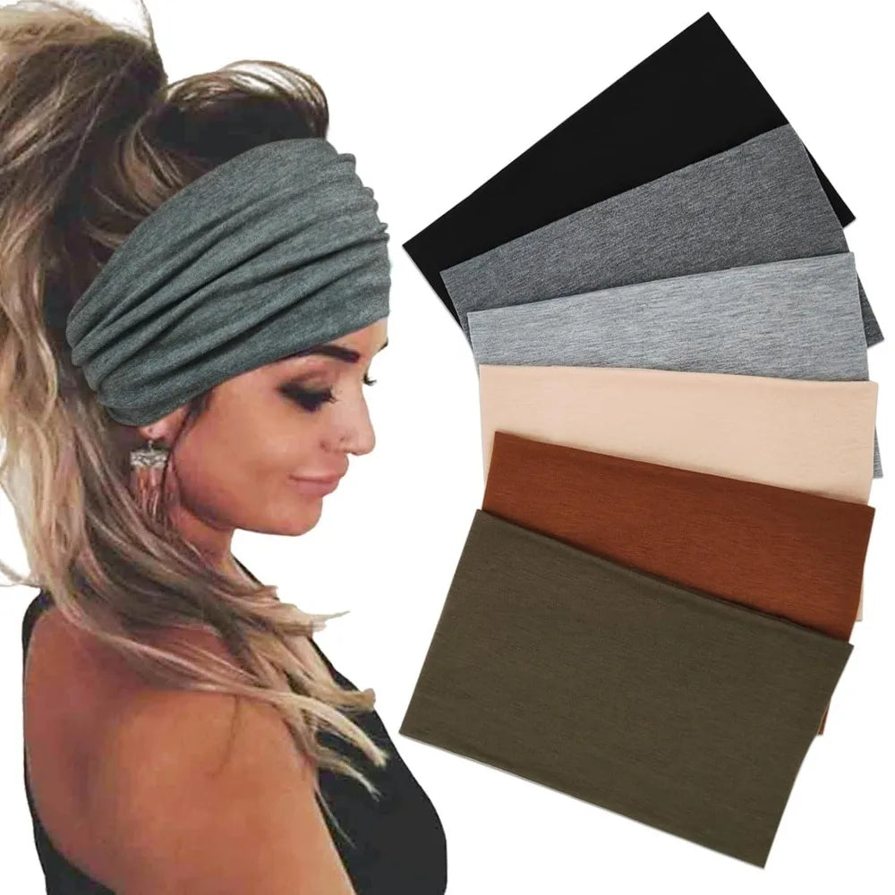 A woman wearing a grey boho headband with blonde hair, next to several stacked headbands in various neutral and earth tones.