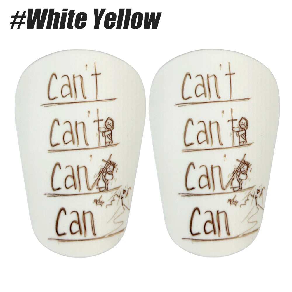 A pair of white yellow durable shin guards for soccer and football training.
