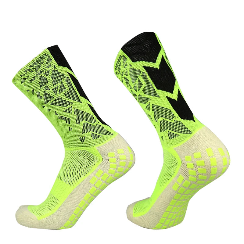 A pair of neon yellow and black anti-slip training socks shown from the side.